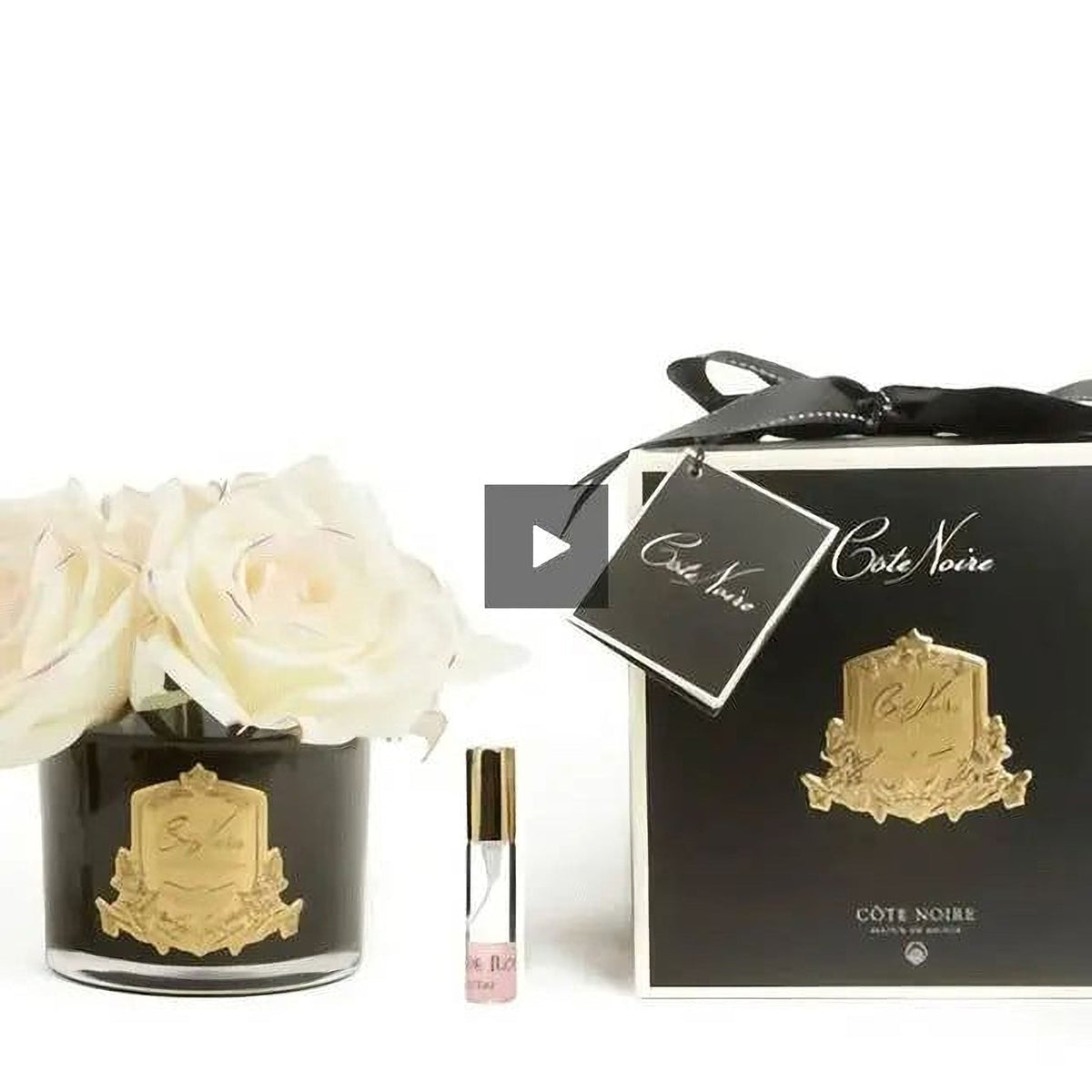 Cote Noire five rose natural touch arrangement in pink blush, black glass with gold crest, side view