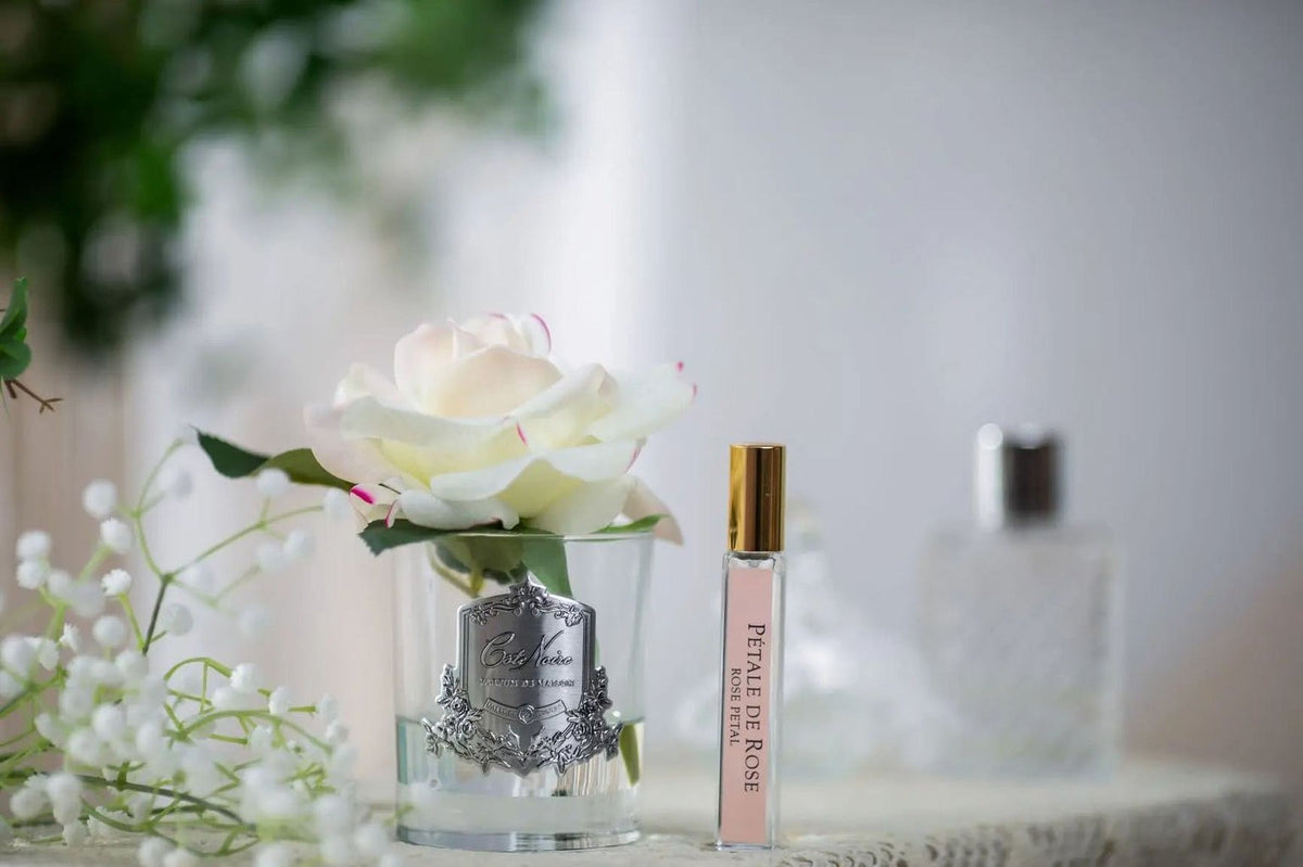 Cote Noire perfumed natural touch single rose in pink blush, clear glass, side view