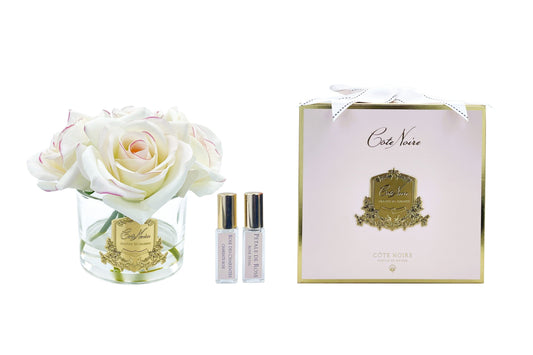 Cote Noire perfumed natural touch roses in clear glass with gold badge, pink blush, pink box