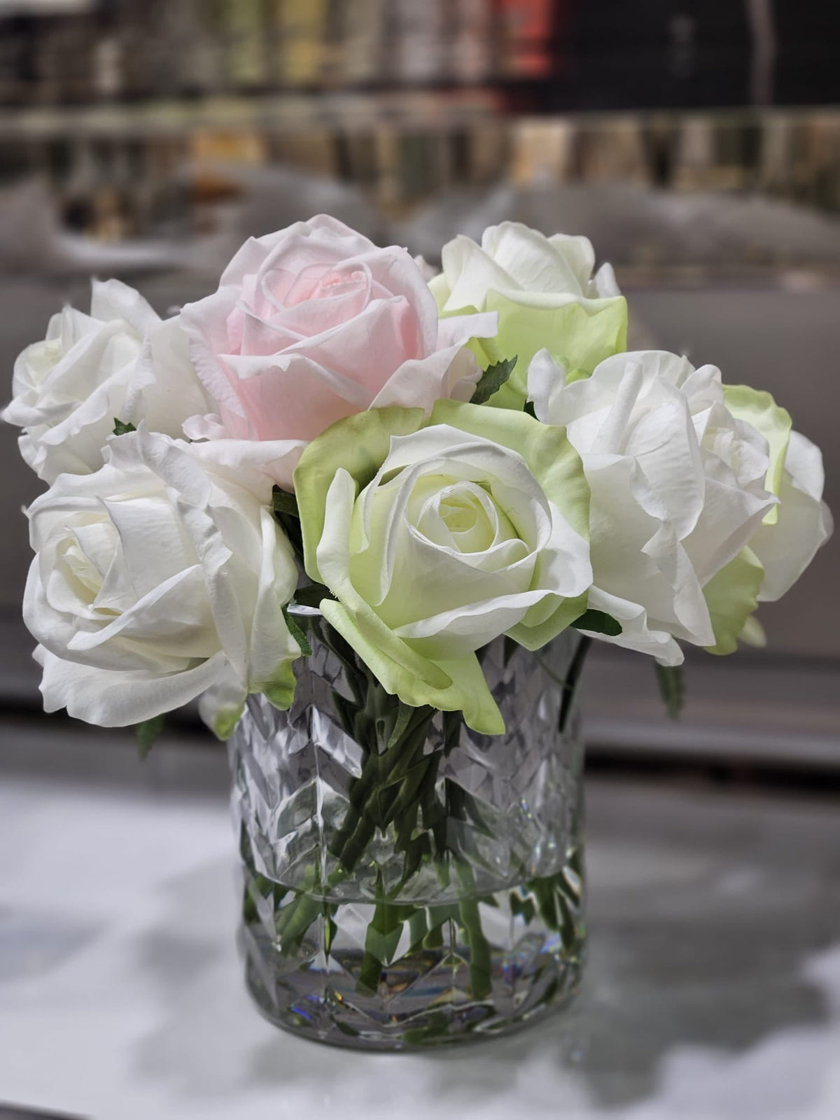 Cote Noire herringbone flower in clear glass with French pink, green and white rose buds, detail view