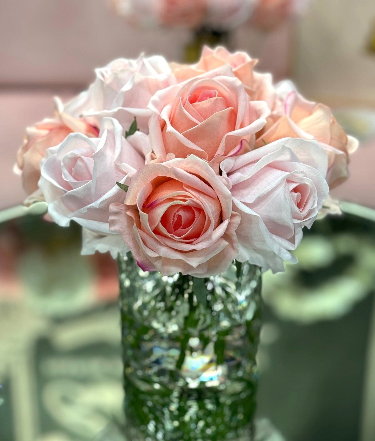Cote Noire herringbone flower in clear glass, mixed pink rose buds, close up
