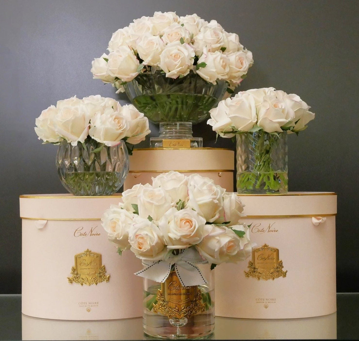 Cote Noire herringbone flower in clear glass with pink blush rose buds, alternate angle