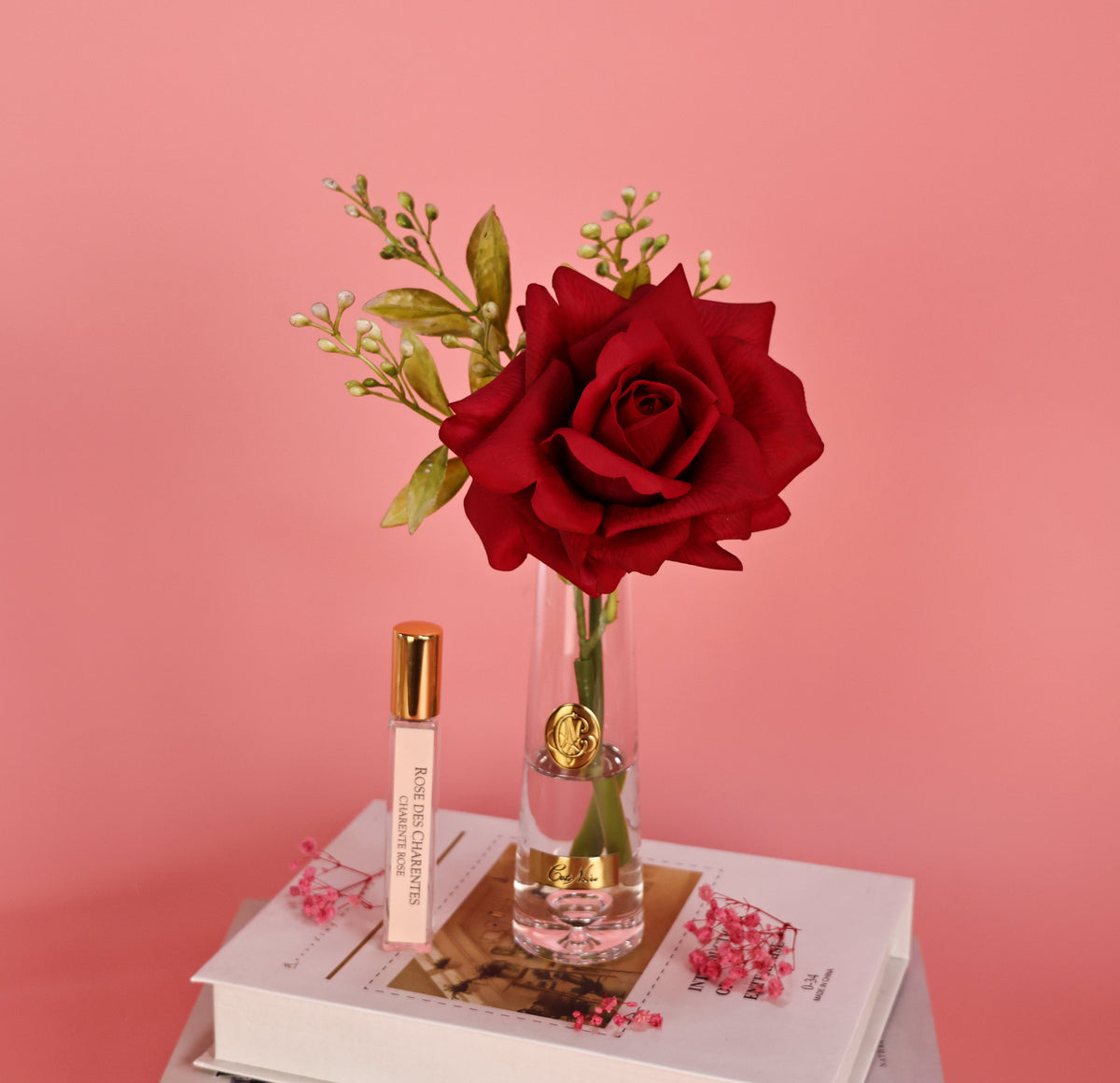 Cote Noire summer rose with gold badge, red, lifestyle shot