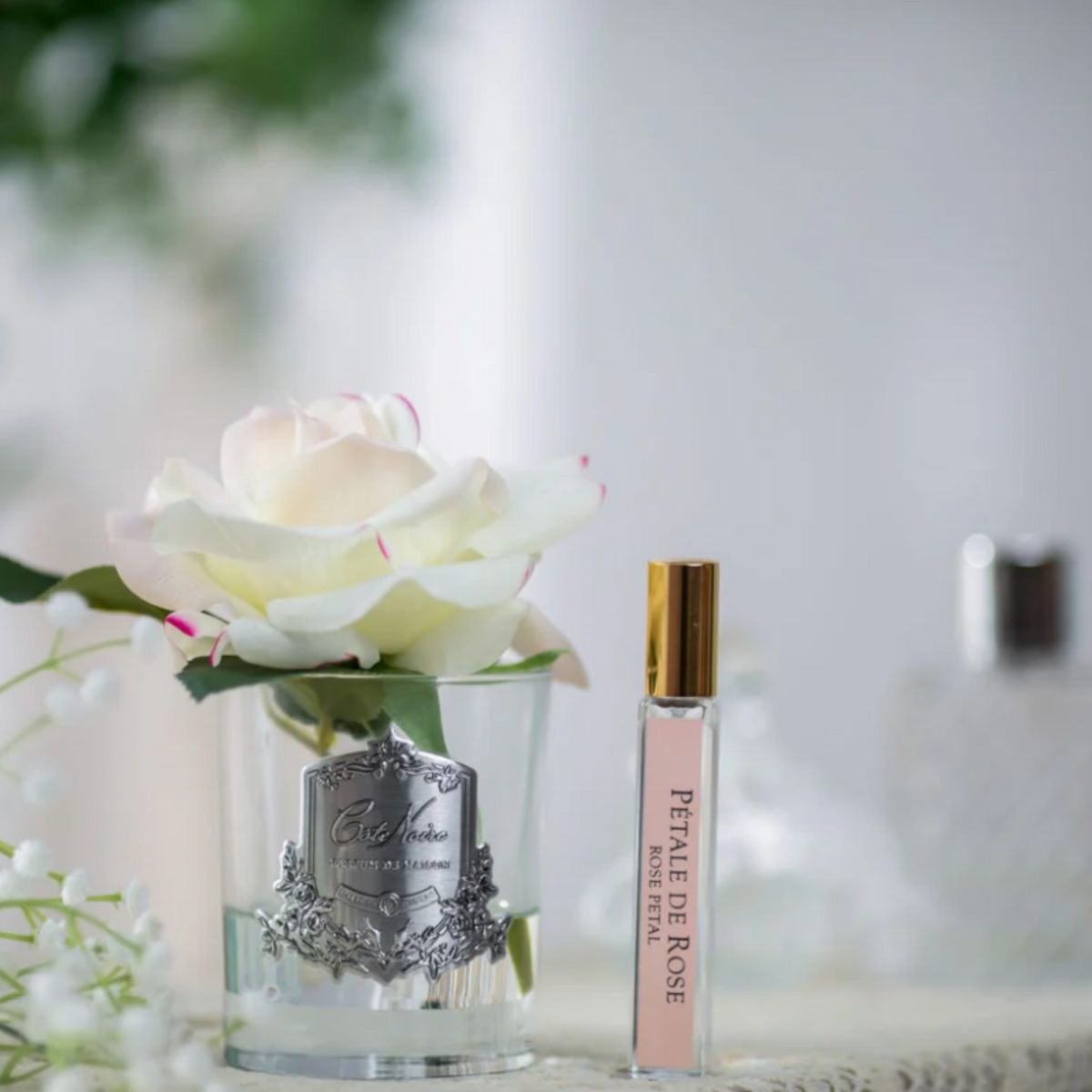 Cote Noire perfumed natural touch single rose in pink blush, clear glass, close up